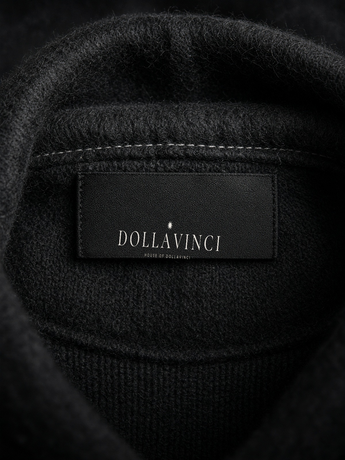 Woven nape label: twelve-point star, DOLLAVINCI, House of Dollavinci, centered